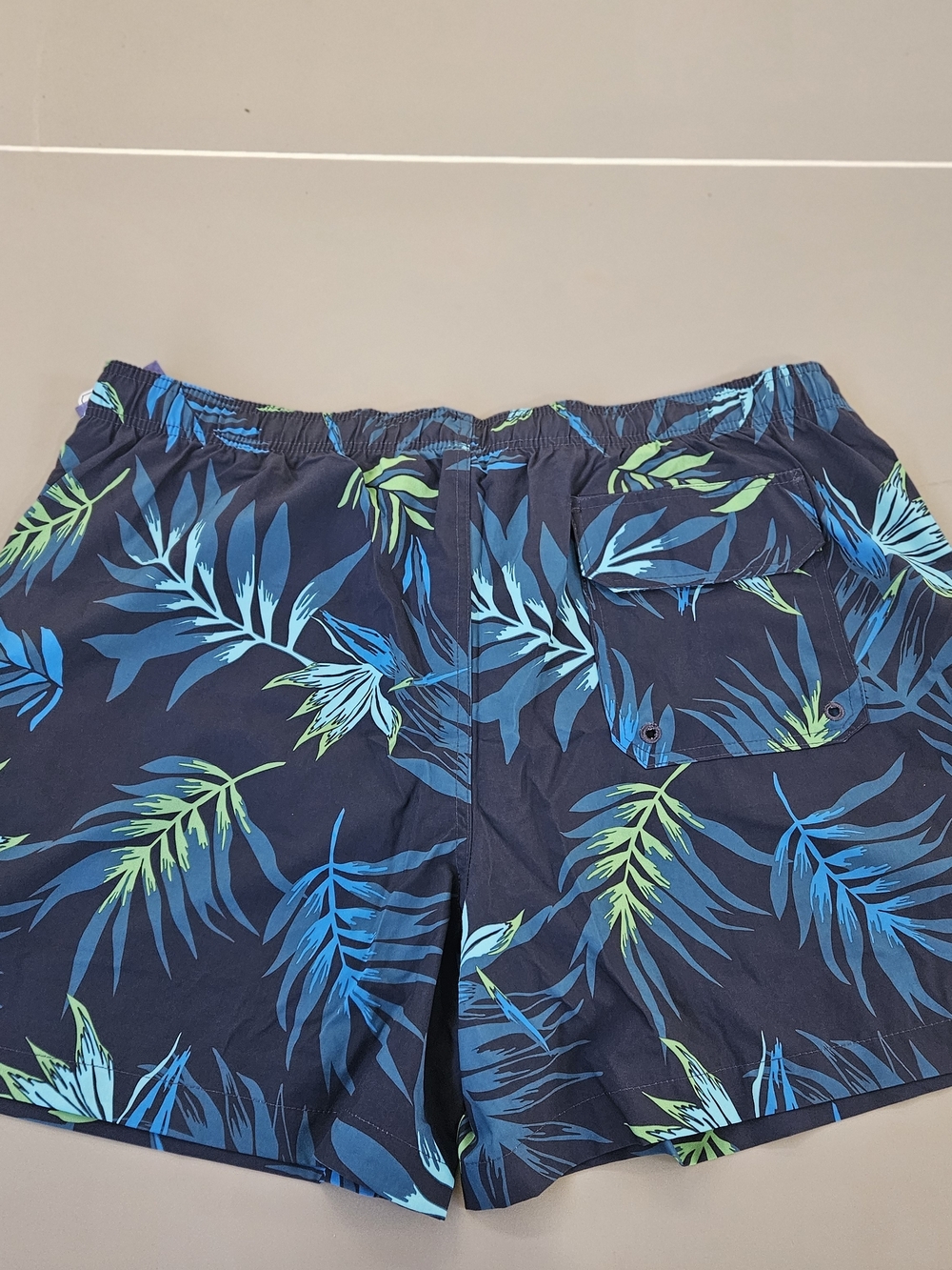 Kanu Surf Navy Swim Trunks with Blue & Green Tropical Leaves